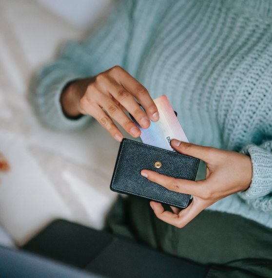 Person taking a credit card out of their wallet