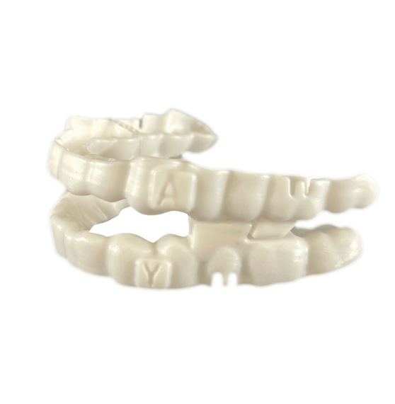 Off white oral appliance against white background