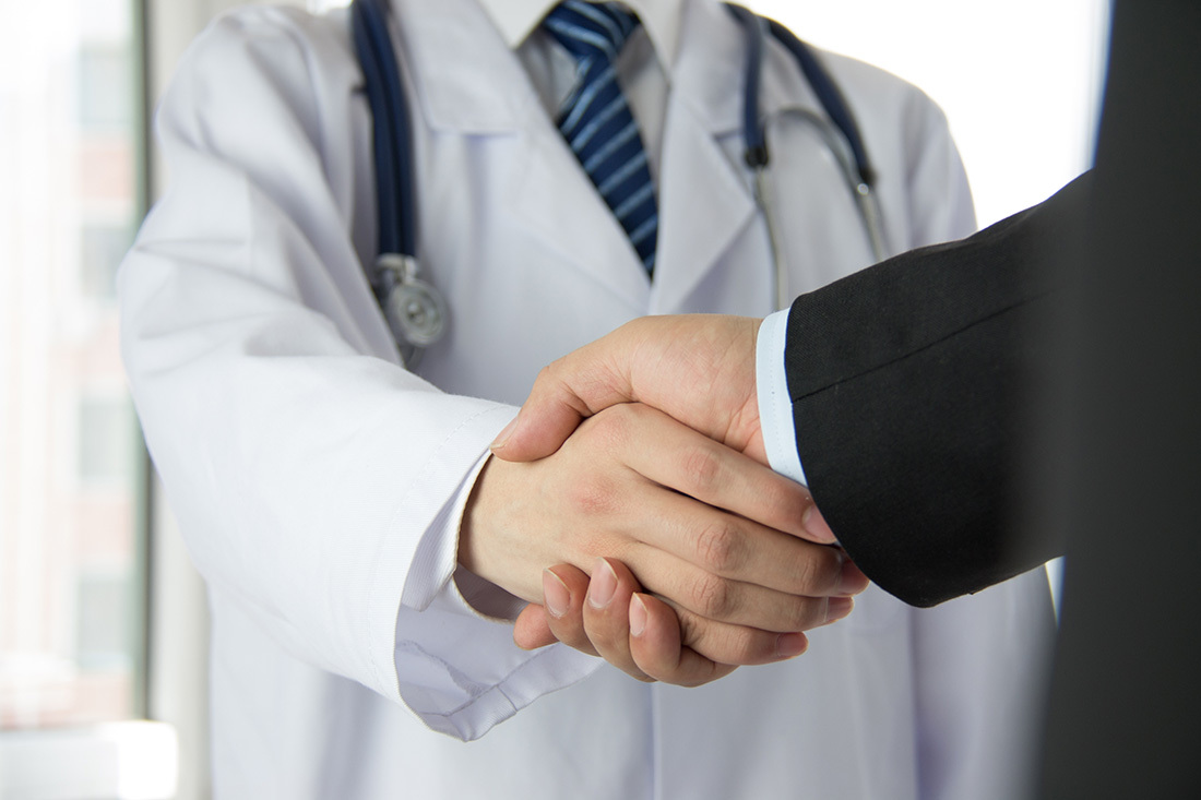 Doctor shaking a patient's hand