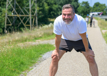 Healthy older man exercising outdoors